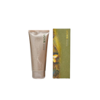 Voya Time To Shine Gentle Body Polish in gold tube packaging next to it 