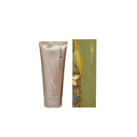 Voya Time To Shine Gentle Body Polish in gold tube packaging next to it 