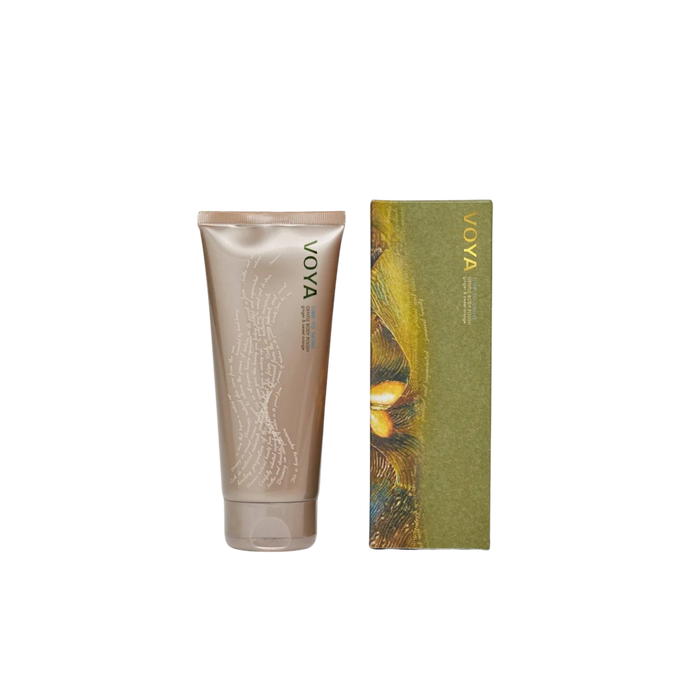 Voya Time To Shine Gentle Body Polish in gold tube packaging next to it 