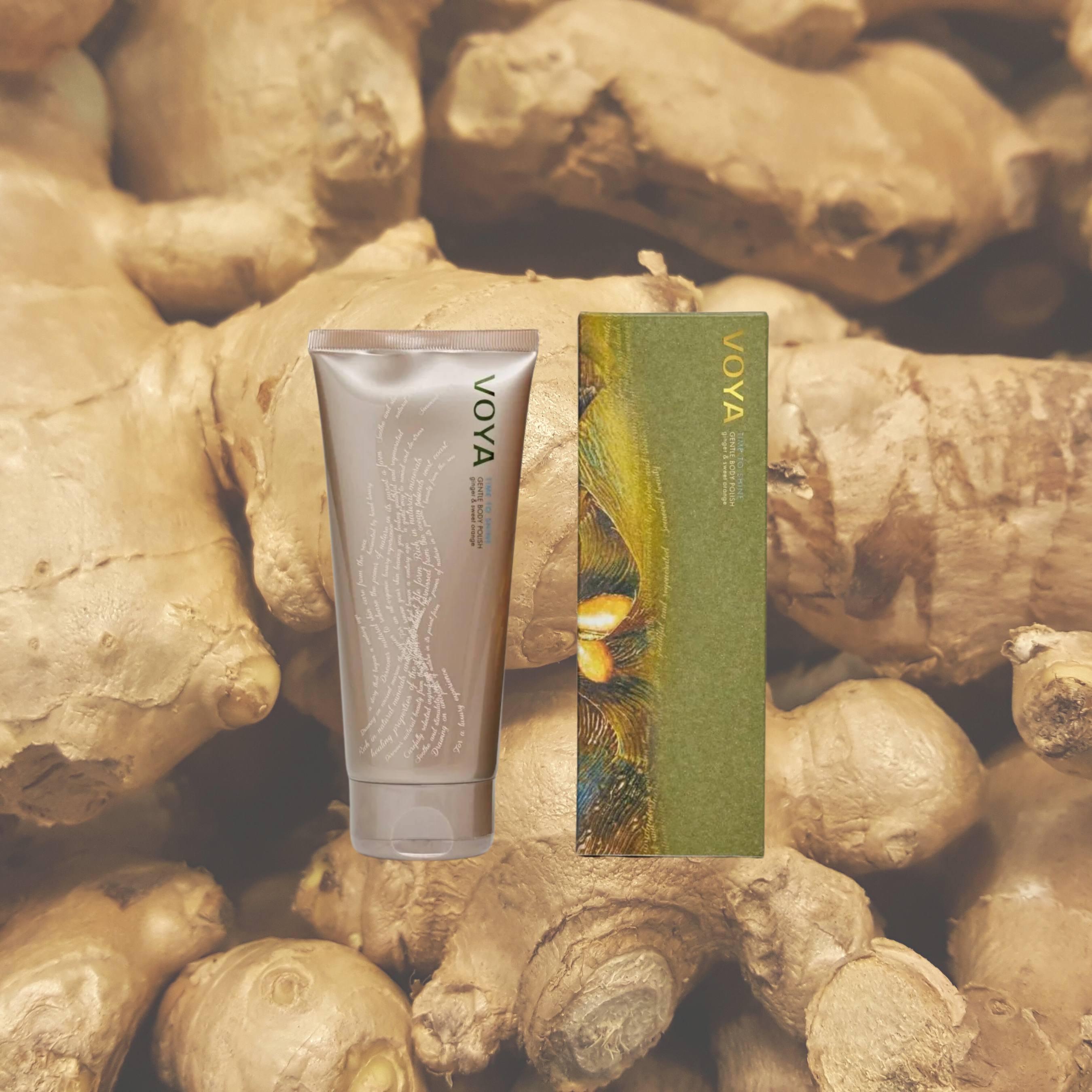 Voya Time To Shine Gentle Body Polish in gold tube packaging next to it 