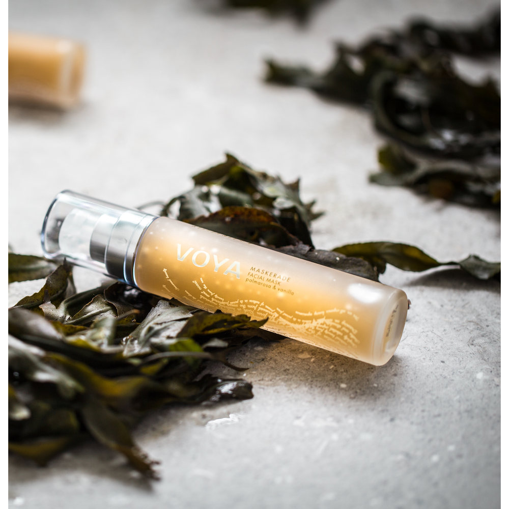 VOYA Maskerade pump Bottle gel mask on a beach with Seaweed