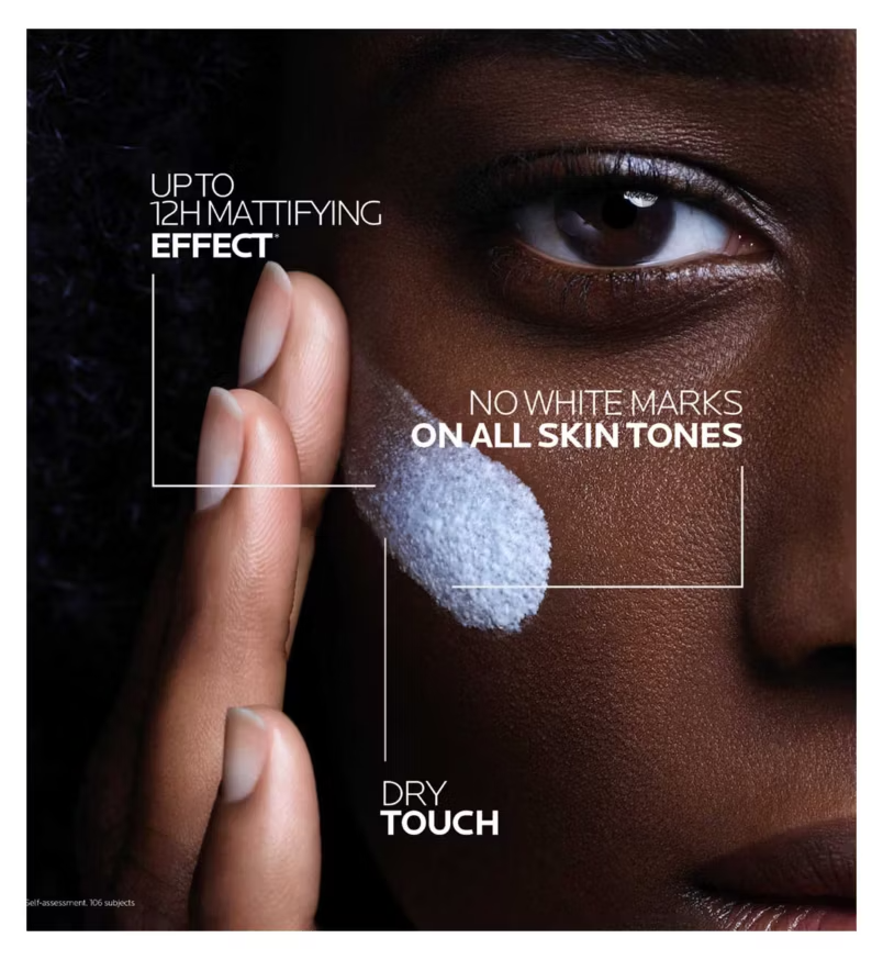 La Roche Posay Anthelios UVMune Oil Control fluid spf50+ 50ml being applied with text showing Mattifying effect, no white marks on all skin tones and dry touch