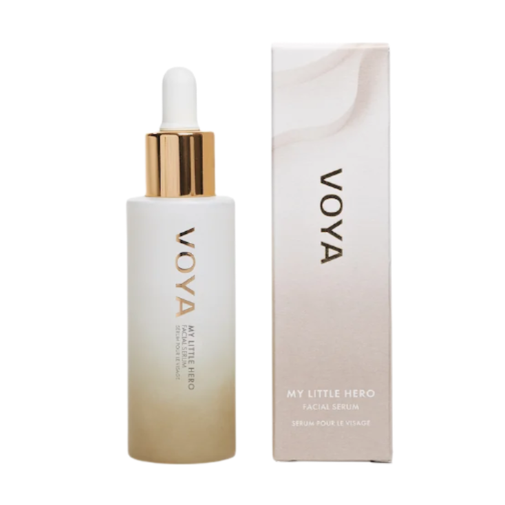 A VOYA My Little Hero bottle with a white label and a gold dropper containing facial serum, alongside its packaging box.
