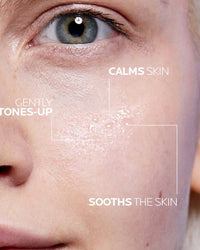 Close-up of a person's face with text indicating skin care benefits