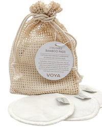 Voya bamboo pads in a woven drawstring bag on a white background